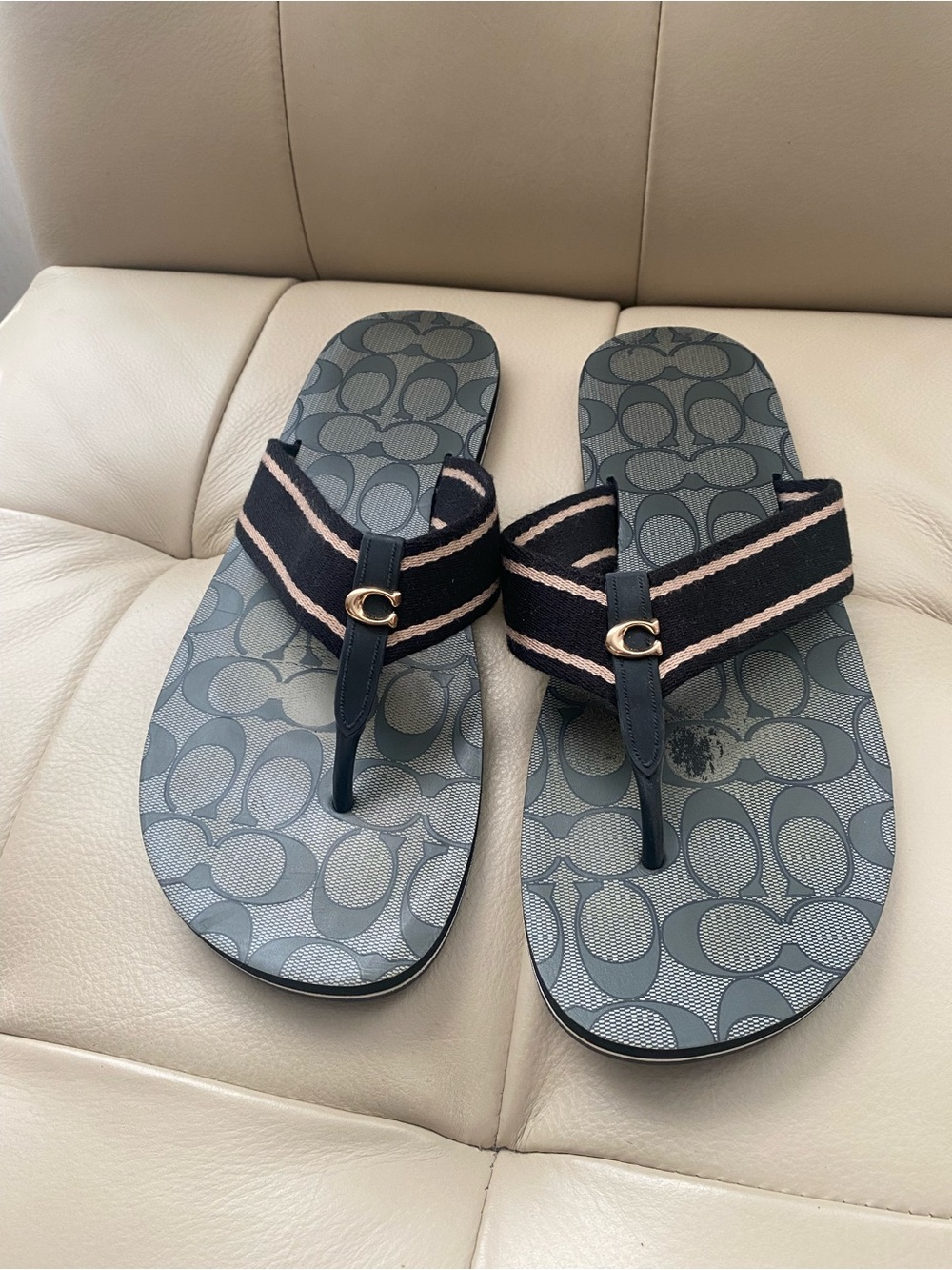 Coach Zoe Logo Flip Flop Sandals in Black and Tan